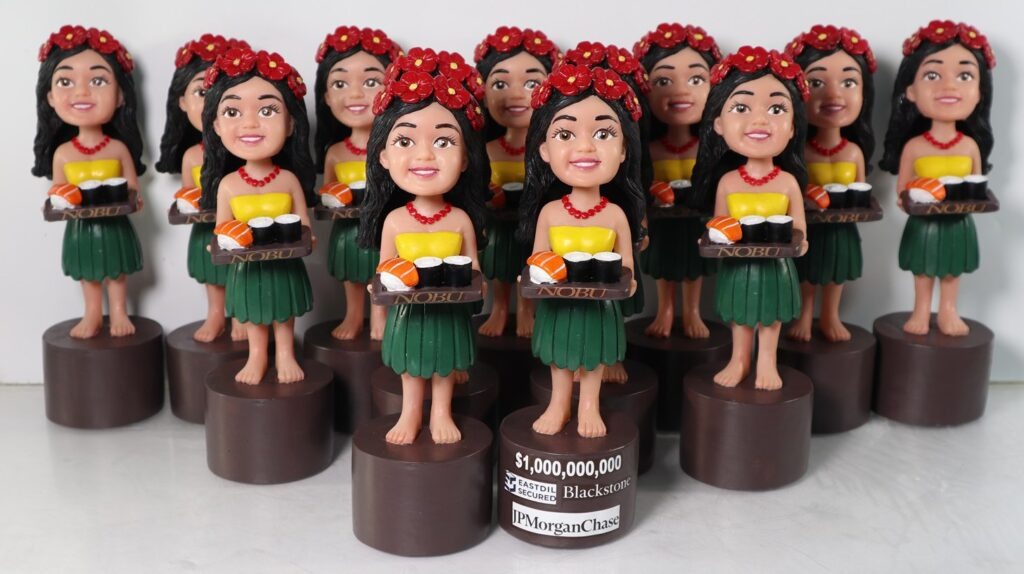 Completed batch of matching custom corporate bobbleheads
